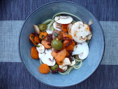 Cold pasta with raw carrots and mushrooms