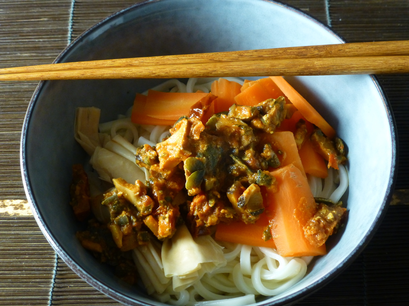 Udon with carrots and tofu skin knots in a mildly spicy sauce